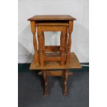 An oak side table and nest of two oak tables