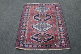 A Caucasian rug on pink ground,