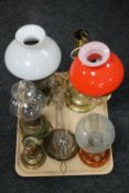 A tray of brass glass shaded paraffin and electrical converted lamps