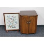 A walnut double door record cabinet together with a tapestry fire screen