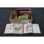 A box of albums of stamps,