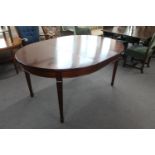 A 20th century extending dining table with leaf
