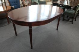 A 20th century extending dining table with leaf