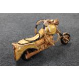A hand built wooden model of a motorcycle