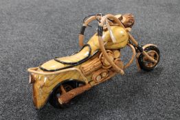 A hand built wooden model of a motorcycle