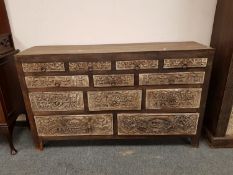 An Eastern carved hardwood multi drawer chest,