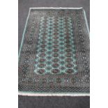 A Bokhara rug on mint ground,