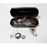A glasses case containing a small quantity of costume jewellery,