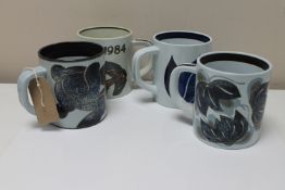 Four Royal Copenhagen faience tankards, height 11.