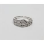 An 18ct white gold diamond set ring, set with brilliant and baguette-cut stones, size L.