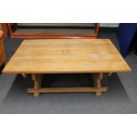 A blond oak refectory coffee table