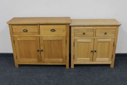 Two contemporary oak double door cabinets fitted with two drawers