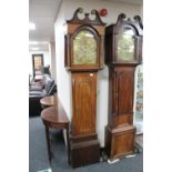An antique mahogany longcase clock with later eight day movement with brass dial signed John