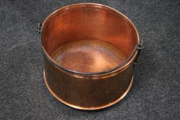 A 20th century copper swing handled cooking pot