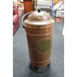 A 20th century copper lidded vessel with handle bearing a brass plaque Handsprojten Reform H.A.G.S.