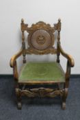 An early twentieth century carved bergere armchair