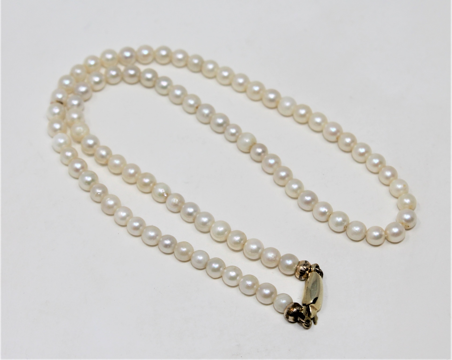 A continental cultured pearl necklace on 14ct gold clasp, length 36cm.