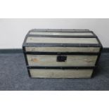 An early 20th century wooden bound shipping trunk