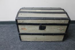 An early 20th century wooden bound shipping trunk