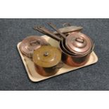 A tray of set of three antique copper cast iron handled lidded pans together with a further copper