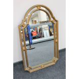 An ornate gilt framed wall mirror