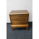 A twentieth century three drawer chest on pine base