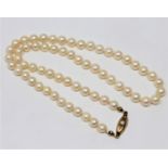 A continental cultured pearl necklace on 14ct gold pearl set clasp, length 41cm.