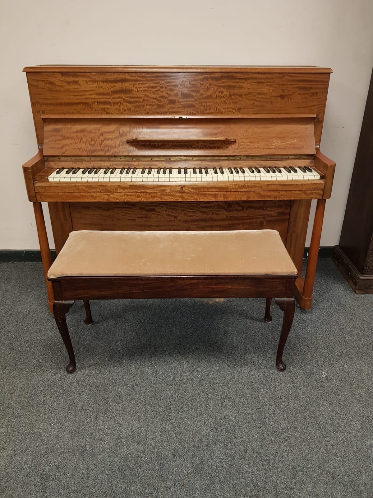A mid twentieth century mahogany Danemann upright piano, width 140 cm, together with duet stool.