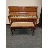 A mid twentieth century mahogany Danemann upright piano, width 140 cm, together with duet stool.