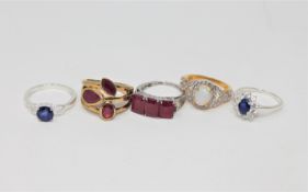 Five silver dress rings set with gemstones