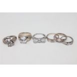 Six silver dress rings