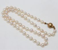 A continental cultured pearl necklace on 14ct gold ball clasp, length 48cm.