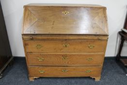 A 19th century oak writing bureau