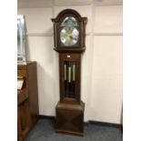 A reproduction mahogany regulator clock with moonphase dial,