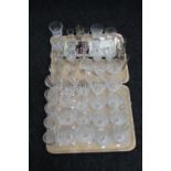 Two trays of crystal, glass, sherry glasses,