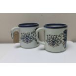 A pair of extra large Royal Copenhagen Faience tankards, height 13.