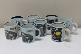 Eight Royal Copenhagen coffee mugs, height 7.