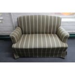 A mid 20th century two seater settee in striped fabric