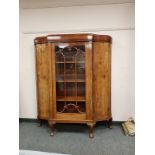 An early twentieth century mahogany bow fronted glazed cabinet,