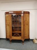 An early twentieth century mahogany bow fronted glazed cabinet,