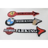Three cast iron arrows : Ferrari, BMW workshops,