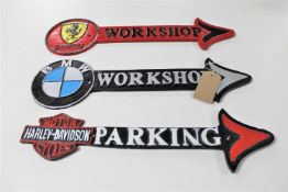 Three cast iron arrows : Ferrari, BMW workshops,