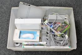 A box of Nintendo Wii with leads and accessories, Wii games, Wii fit board,