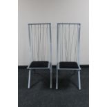 A pair of contemporary metal high backed dining chairs