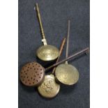 Four antique brass and copper bed warming pans