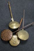 Four antique brass and copper bed warming pans