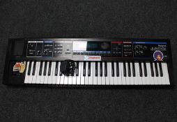 A Roland Juno-Di mobile synthesizer with song player and lead