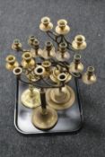 A tray of five 20th century brass candelabra