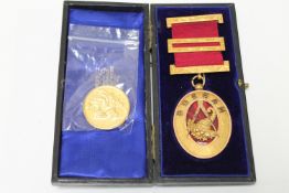 A gilt and enamelled Masonic Durham medal and a silver-gilt Masonic medallion