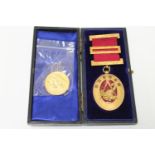 A gilt and enamelled Masonic Durham medal and a silver-gilt Masonic medallion